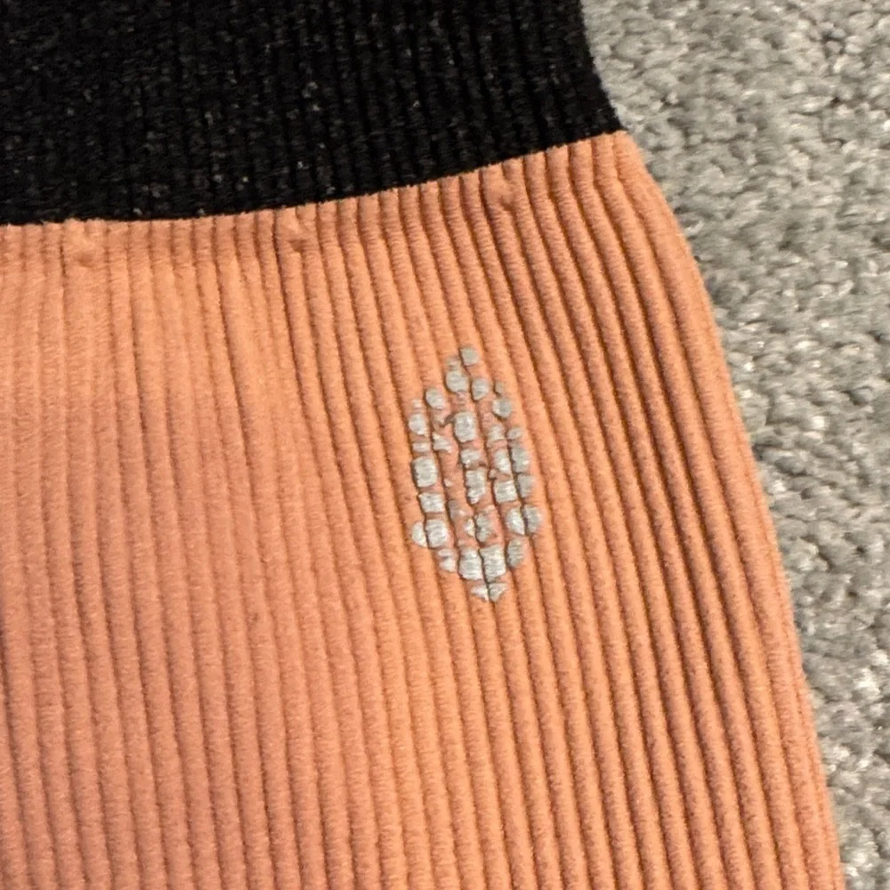 FP Movement by Free People Ribbed Athletic Shorts in Peach and Black